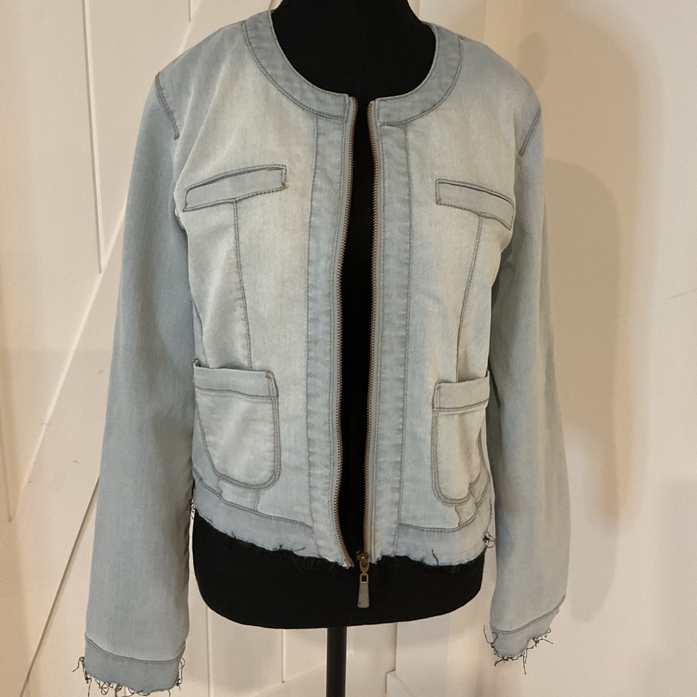 Sandwich_ Collarless  blue Denim  jacket with frayed edges and pockets.